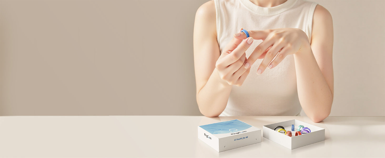 Woman wearing a blue smart ring, boxes of smart rings on the table