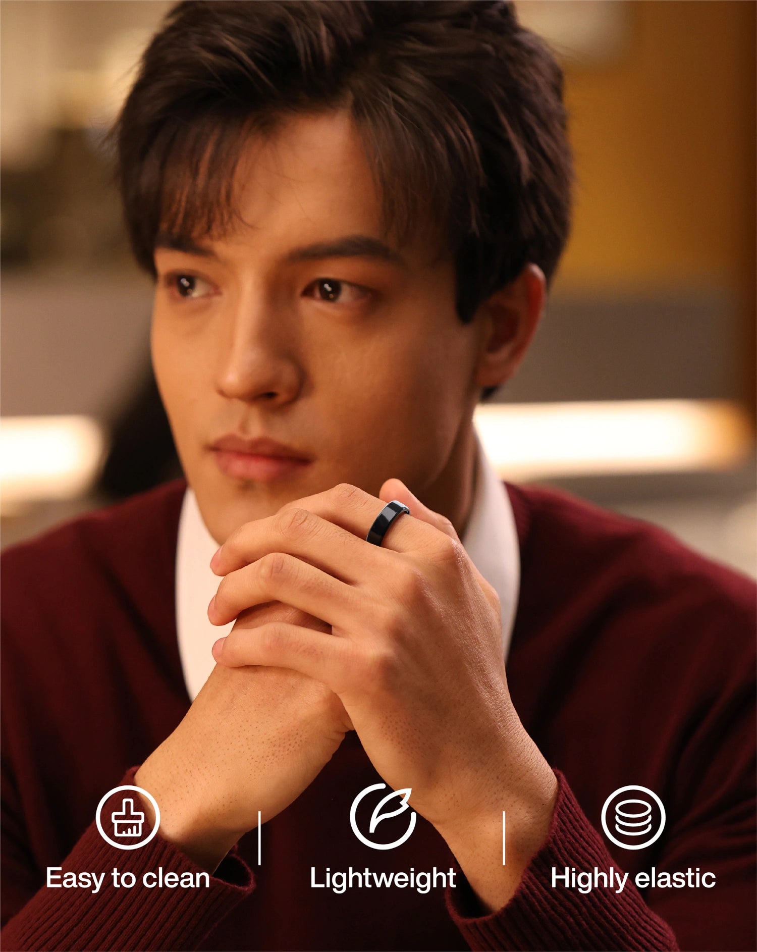 Man wearing black smart ring, highlighting lightweight, easy-to-clean, and highly elastic features.