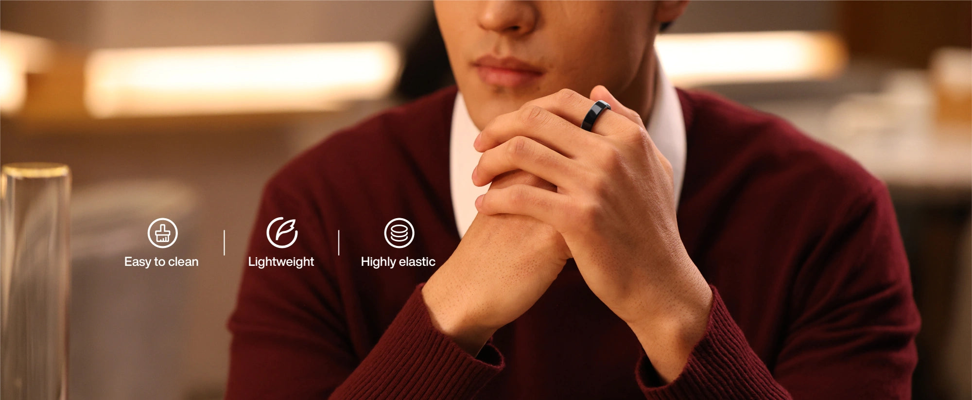Man wearing a black smart ring, highlighting lightweight, easy-to-clean, and highly elastic features.