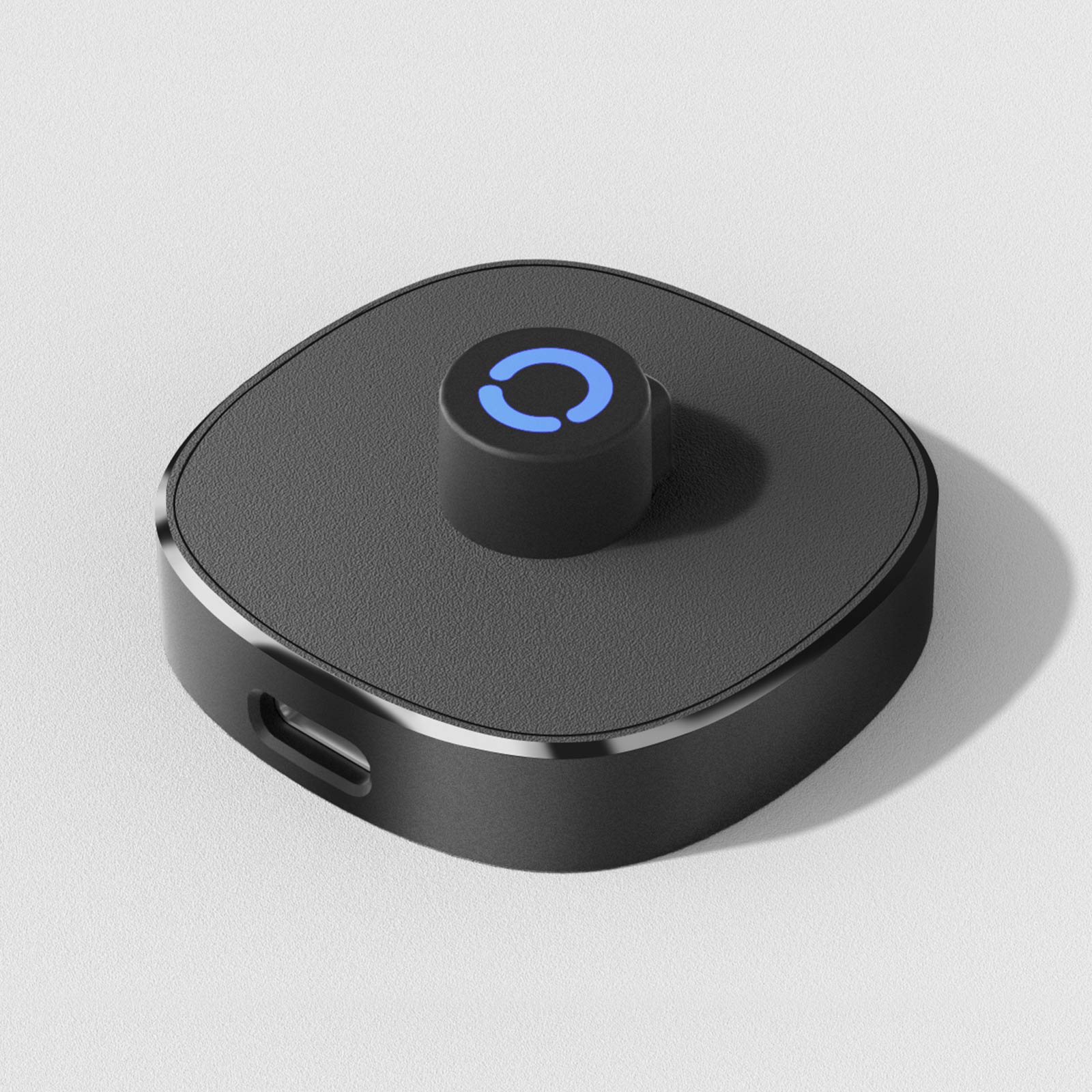 Black smart ring charging dock with blue indicator light. Effortless magnetic charging for sleep tracking ring.
