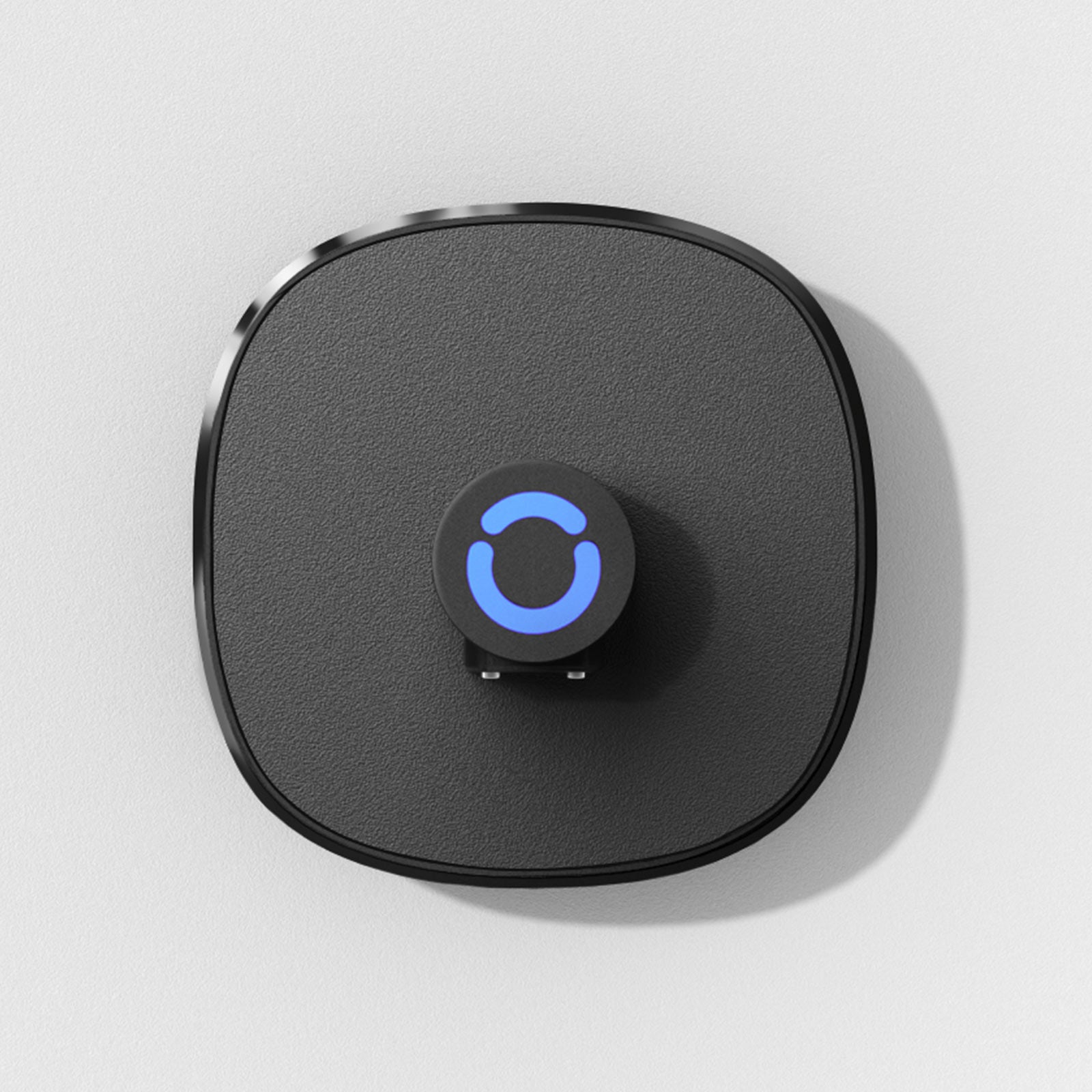 Black smart ring charging dock with blue light indicator. Effortless magnetic charging for sleep tracking ring.