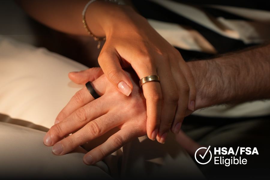 Hands clasped with a gold and black smart ring, HSA/FSA Eligible