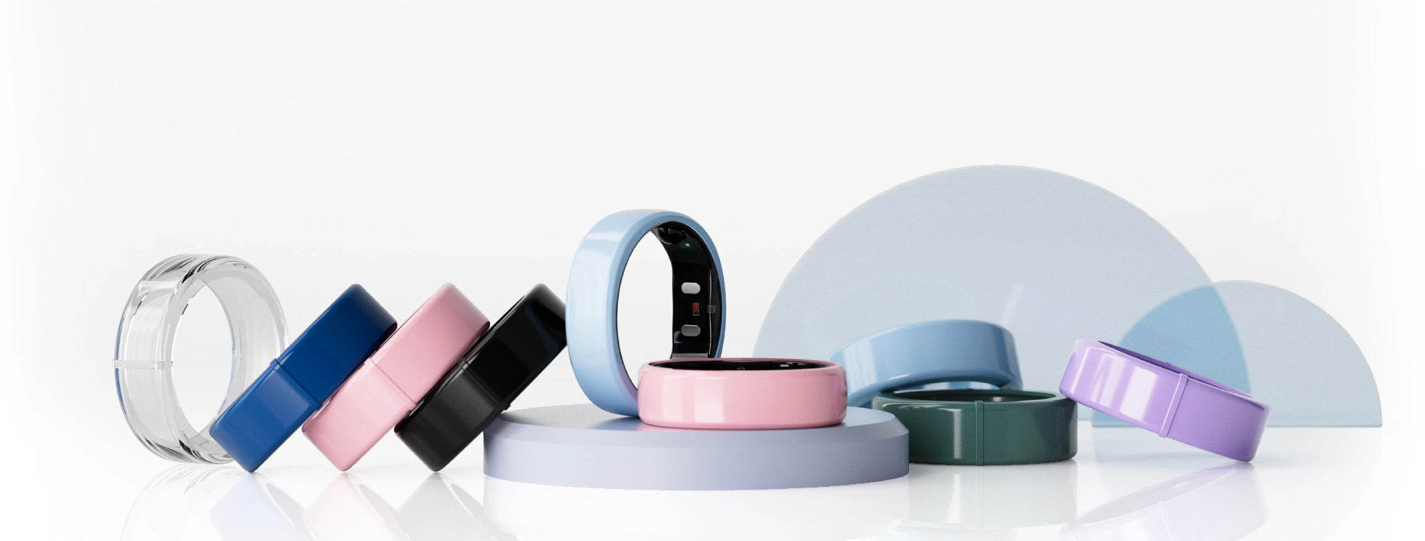 Collection of smart rings in various colors and designs, showcasing sleek health tracking technology.
